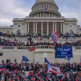 The Capitol building in D.C and Trump supporters all over it.